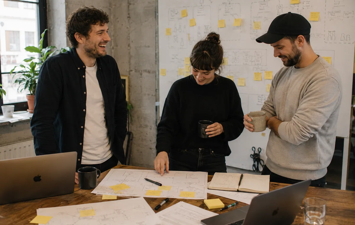 Marketing team reviewing social ad variants